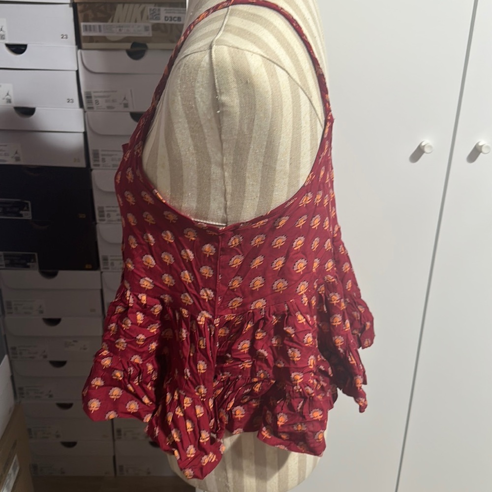 Patrons of peace peplum top